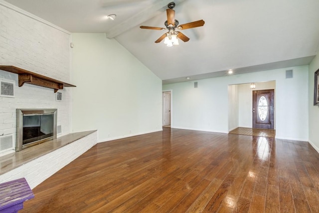 unfurnished living room featuring baseboards, hardwood / wood-style flooring, ceiling fan, beamed ceiling, and a fireplace