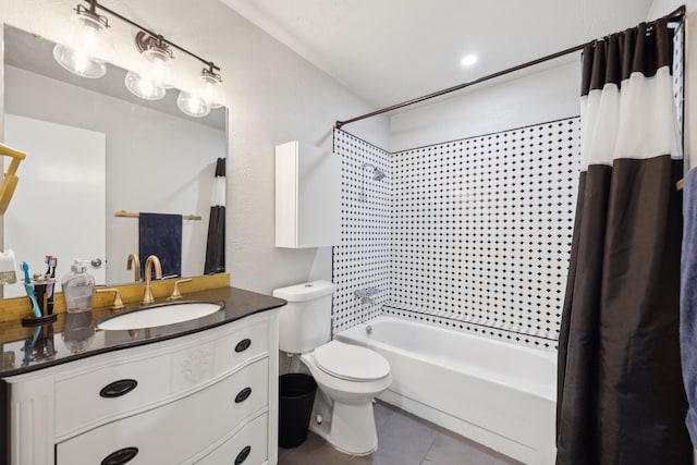 bathroom with vanity, tile patterned flooring, shower / bath combo with shower curtain, and toilet