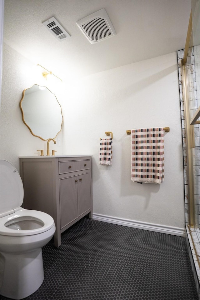 1606 Denver Ave, Fort Worth, TX 76164 - bathroom featuring toilet, vanity, a shower, and baseboards