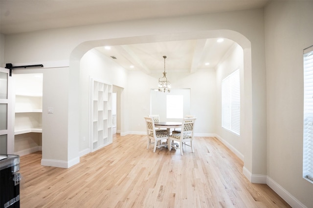 1606 Denver Ave, Fort Worth, TX 76164 - dining room with arched walkways, light wood finished floors, recessed lighting, and baseboards
