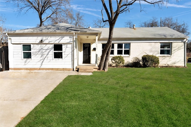 ranch-style home with a front lawn and brick siding