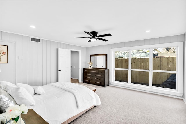 carpeted bedroom with ceiling fan, visible vents, and recessed lighting