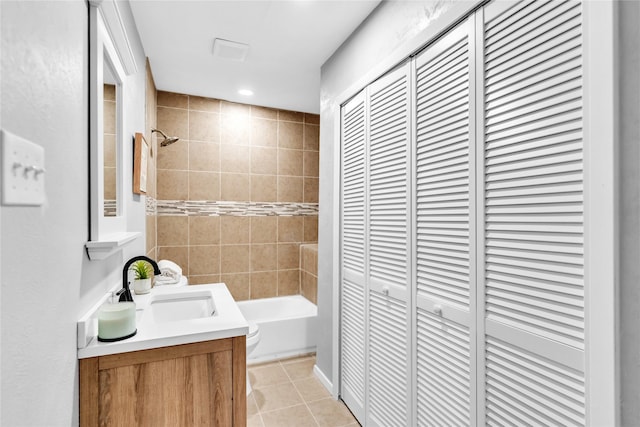 full bathroom with toilet, vanity, tile patterned flooring, shower / bathtub combination, and a closet