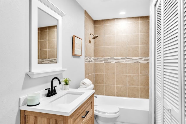 full bath featuring shower / bathing tub combination, a closet, vanity, and toilet