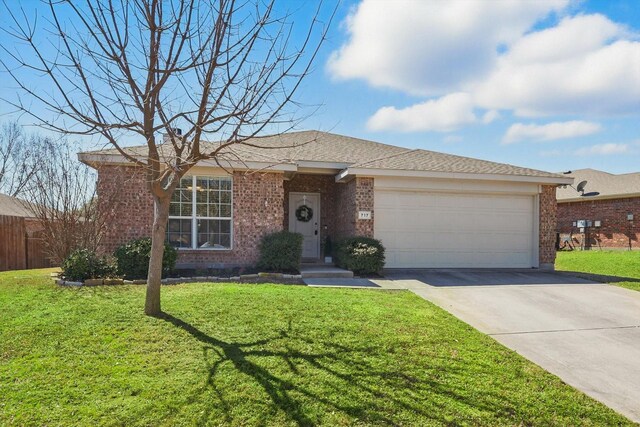 ranch-style house featuring brick siding, a shingled roof, a front lawn, driveway, and an attached garage