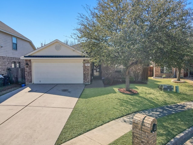 view of front of house featuring brick siding, fence, a garage, driveway, and a front lawn