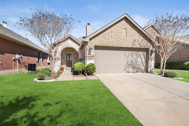 view of front of property featuring driveway, brick siding, central AC unit, an attached garage, and a front yard