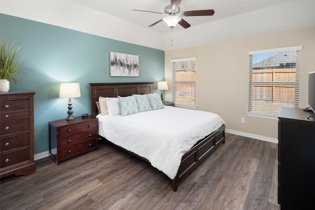 bedroom with wood finished floors, a ceiling fan, and baseboards