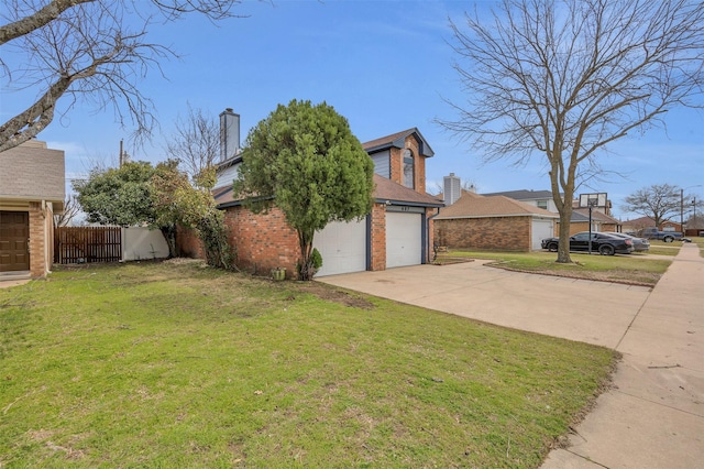 view of home's exterior with a garage, concrete driveway, brick siding, and a yard