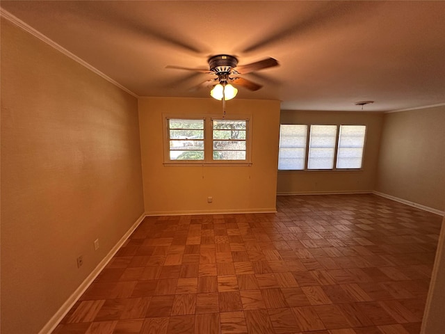 unfurnished room with ceiling fan, ornamental molding, and baseboards