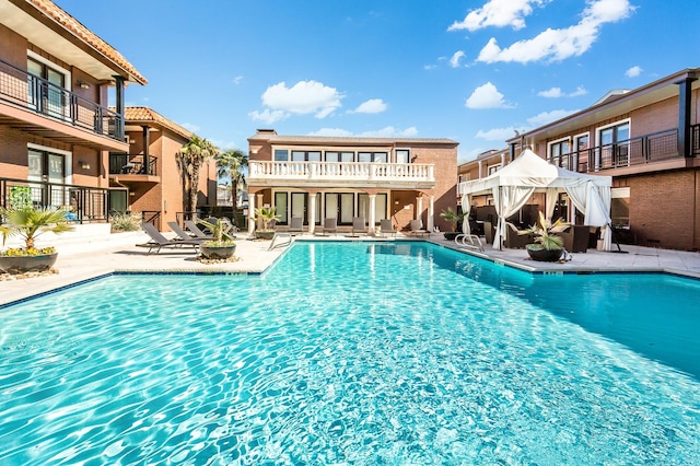 community pool with a patio