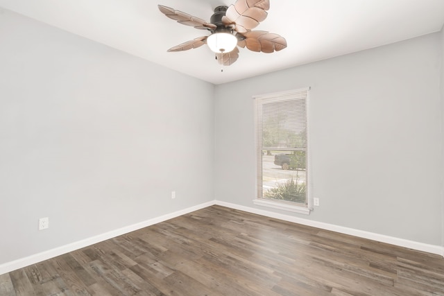 unfurnished room with ceiling fan, baseboards, and wood finished floors