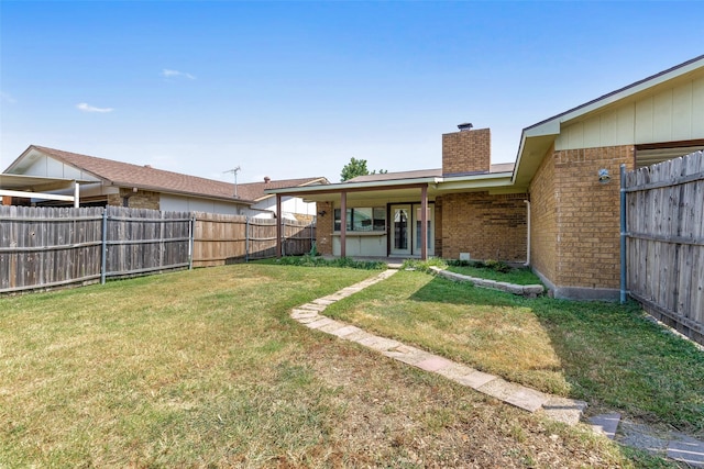 view of yard with a fenced backyard