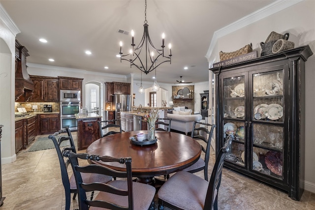 dining area featuring arched walkways, ornamental molding, visible vents, and recessed lighting