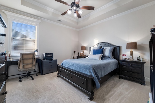 bedroom featuring visible vents, a raised ceiling, and light colored carpet