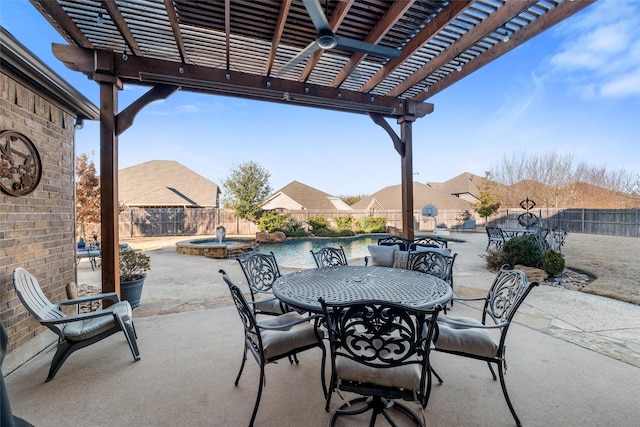 view of patio with a fenced backyard, a pool with connected hot tub, outdoor dining area, and a pergola