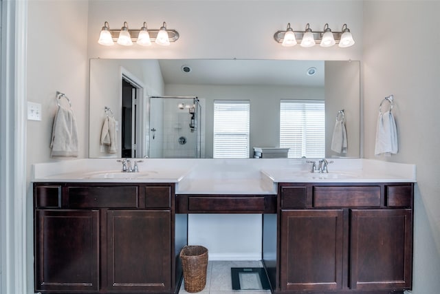 full bath with a stall shower and vanity