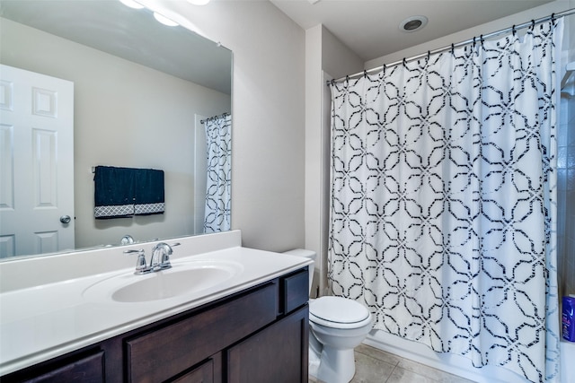 full bath featuring toilet, tile patterned floors, and vanity