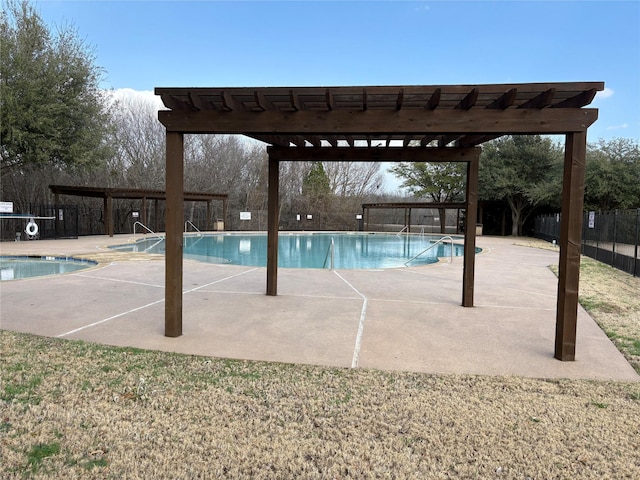 community pool with a patio area, fence, and a pergola