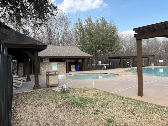 community pool with a patio and a pergola