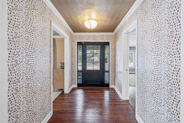 foyer featuring crown molding, a textured ceiling, and wallpapered walls