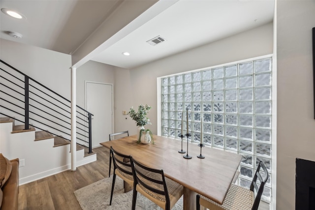 dining area featuring stairway, visible vents, wood finished floors, and recessed lighting