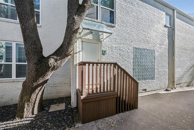 property entrance with brick siding