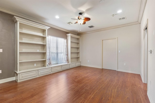 unfurnished bedroom with visible vents, baseboards, and wood finished floors