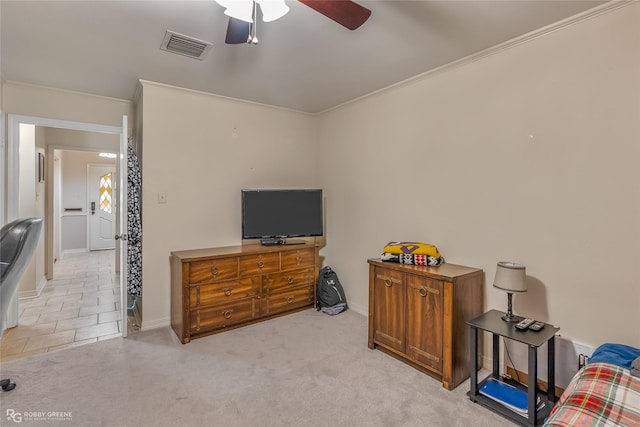 interior space with ornamental molding, light colored carpet, and visible vents