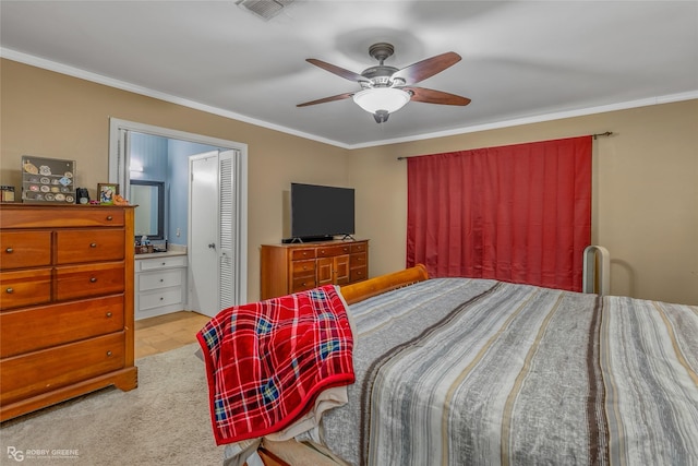 bedroom with ornamental molding, visible vents, ceiling fan, and ensuite bathroom