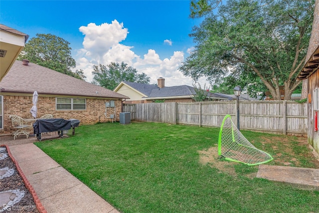 view of yard featuring cooling unit and a fenced backyard