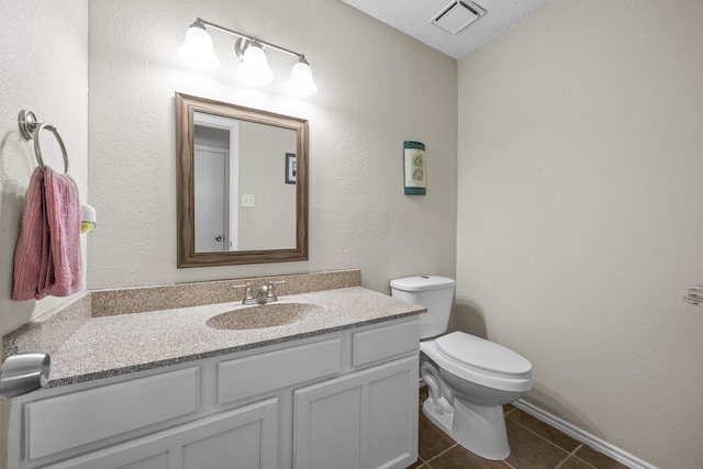 bathroom with visible vents, toilet, tile patterned floors, a textured ceiling, and vanity