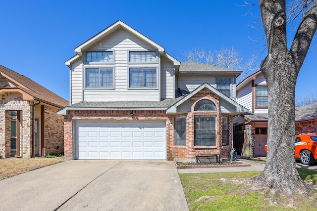 traditional home featuring concrete driveway, brick siding, an attached garage, and roof with shingles