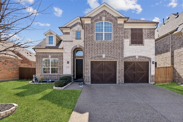 french provincial home with brick siding, fence, stone siding, driveway, and a front lawn