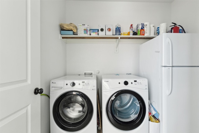 laundry area featuring laundry area and washing machine and clothes dryer