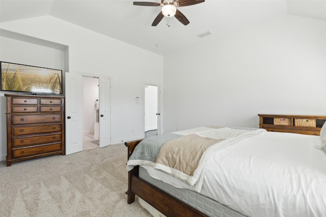 bedroom with ceiling fan, visible vents, vaulted ceiling, and light colored carpet