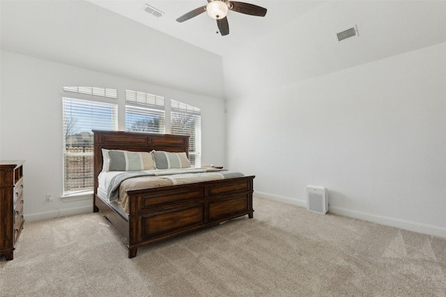 bedroom with baseboards, visible vents, and light colored carpet