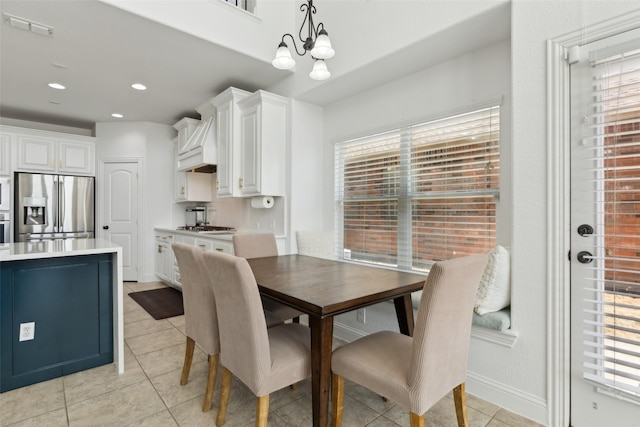 dining area with a healthy amount of sunlight, visible vents, and light tile patterned floors