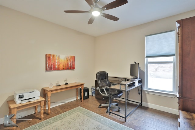 office area featuring wood finished floors, a ceiling fan, and baseboards