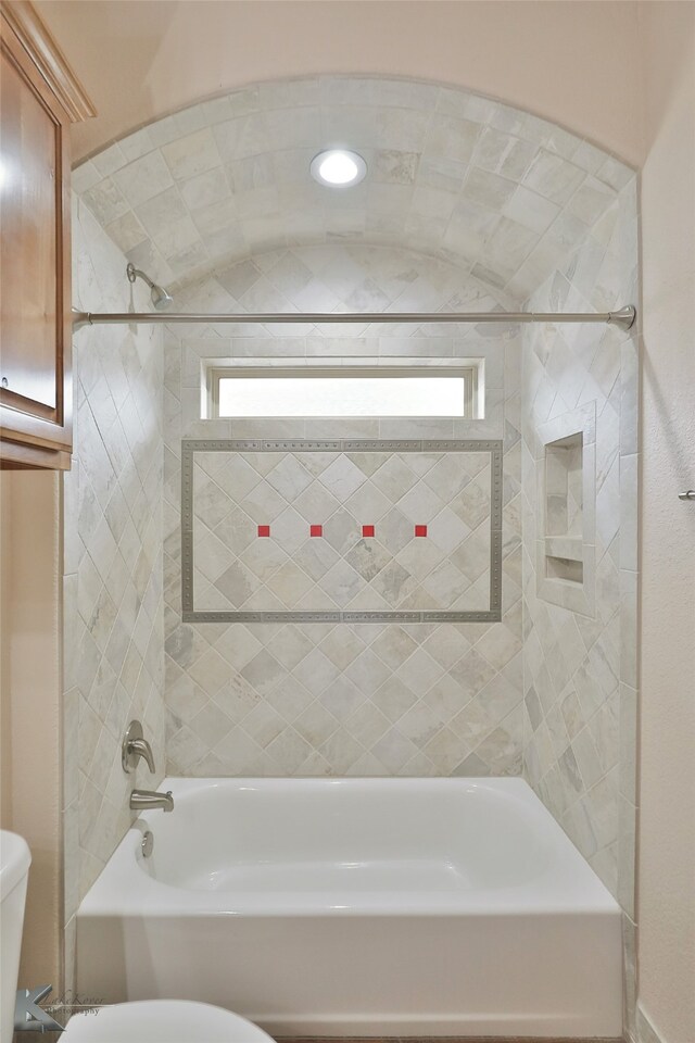 full bathroom with toilet,  shower combination, and a wealth of natural light