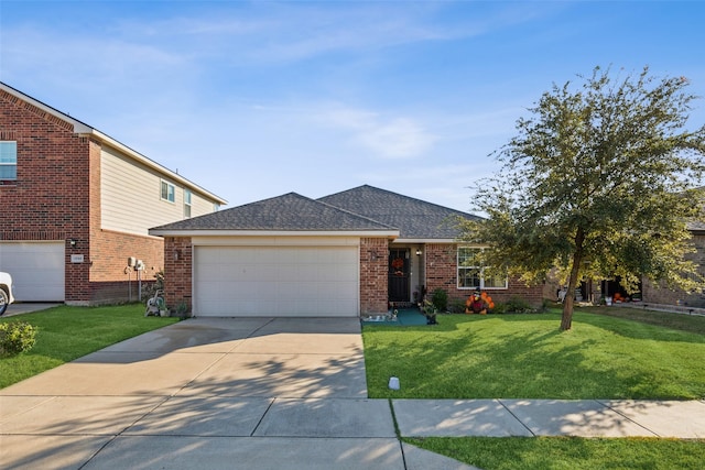 ranch-style home with driveway, a garage, a shingled roof, a front yard, and brick siding