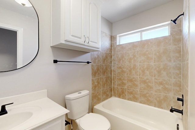 bathroom with toilet, bathtub / shower combination, and vanity