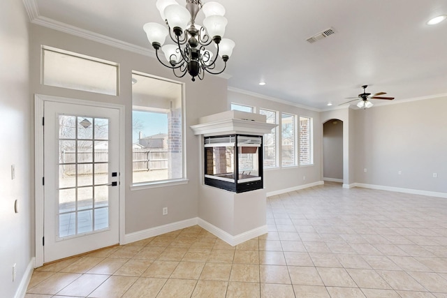 interior space featuring ornamental molding, arched walkways, visible vents, and light tile patterned floors