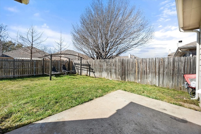 view of yard with a fenced backyard and a patio