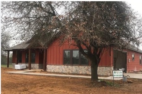 exterior space featuring stone siding and board and batten siding