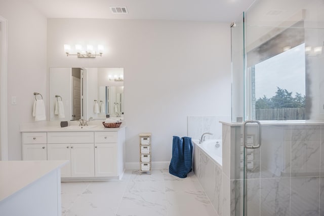 bathroom featuring vanity, visible vents, marble finish floor, a shower stall, and a bath