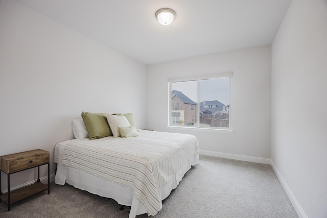 carpeted bedroom with baseboards