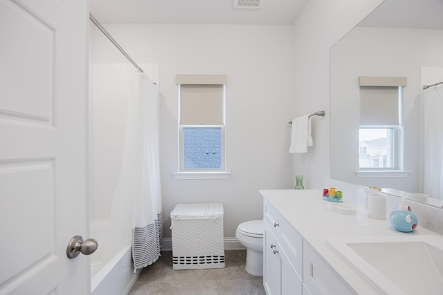 full bathroom with visible vents, toilet, tile patterned flooring, shower / bath combo with shower curtain, and vanity