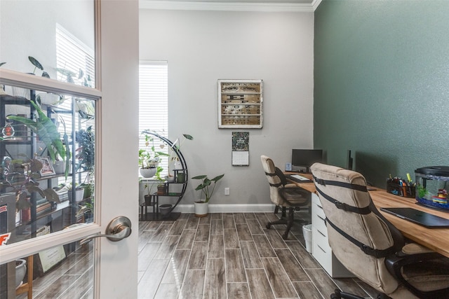 office area featuring baseboards, wood finish floors, and crown molding