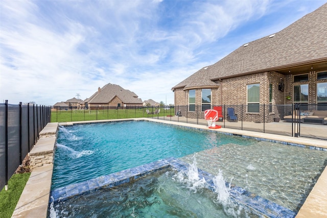 view of pool with a patio area, a fenced backyard, and a pool with connected hot tub